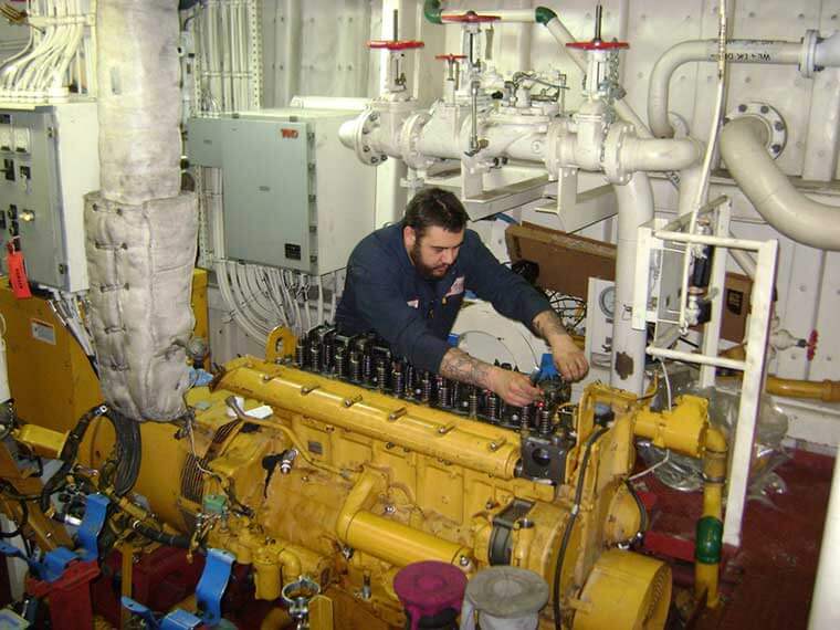 USCGC Anthony Petit - Technician works on marine engine